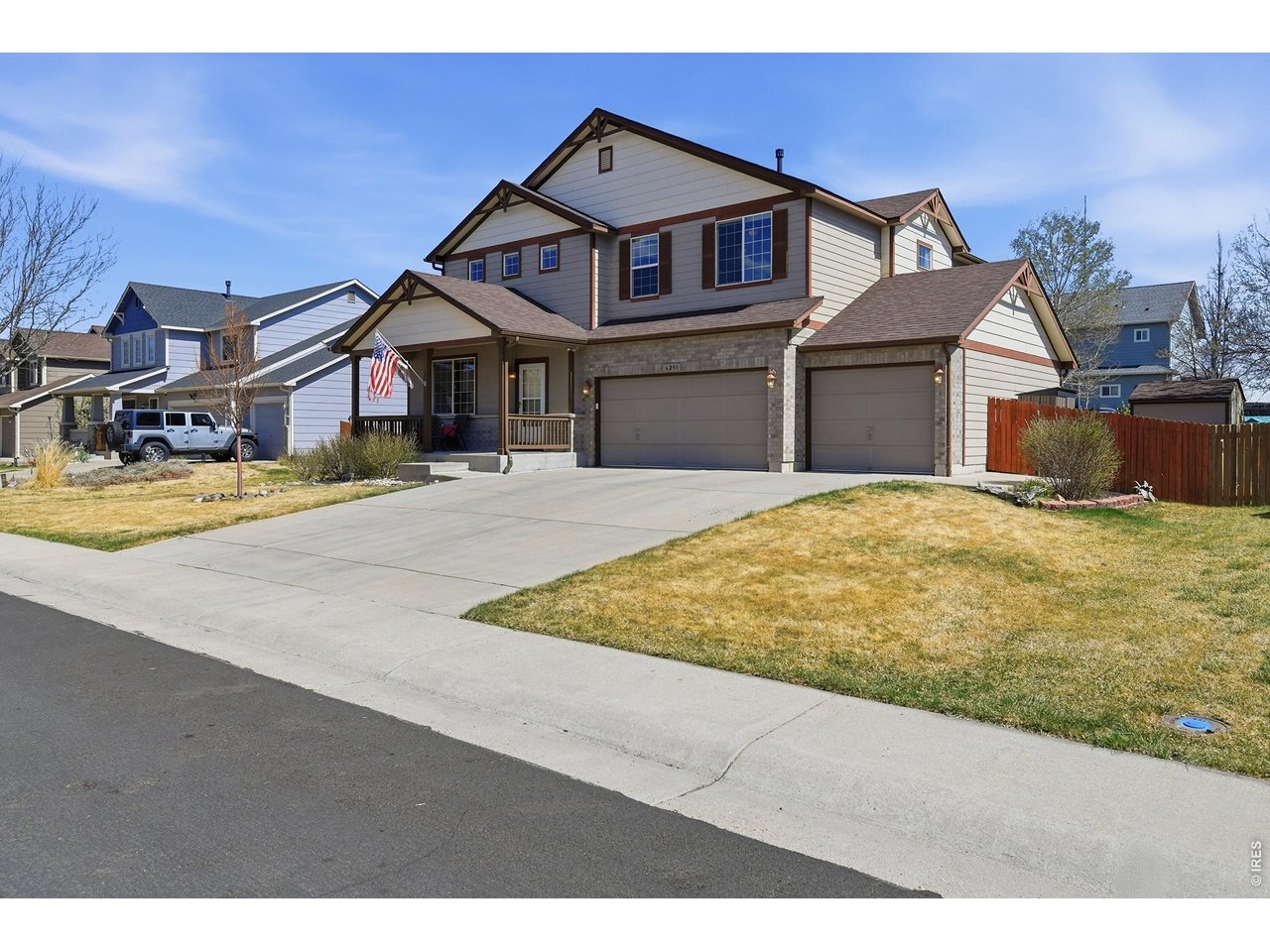 6291 Taylor Street Frederick, CO 80530 - Photo 2 of 50 a view of a big house with a big yard and large trees