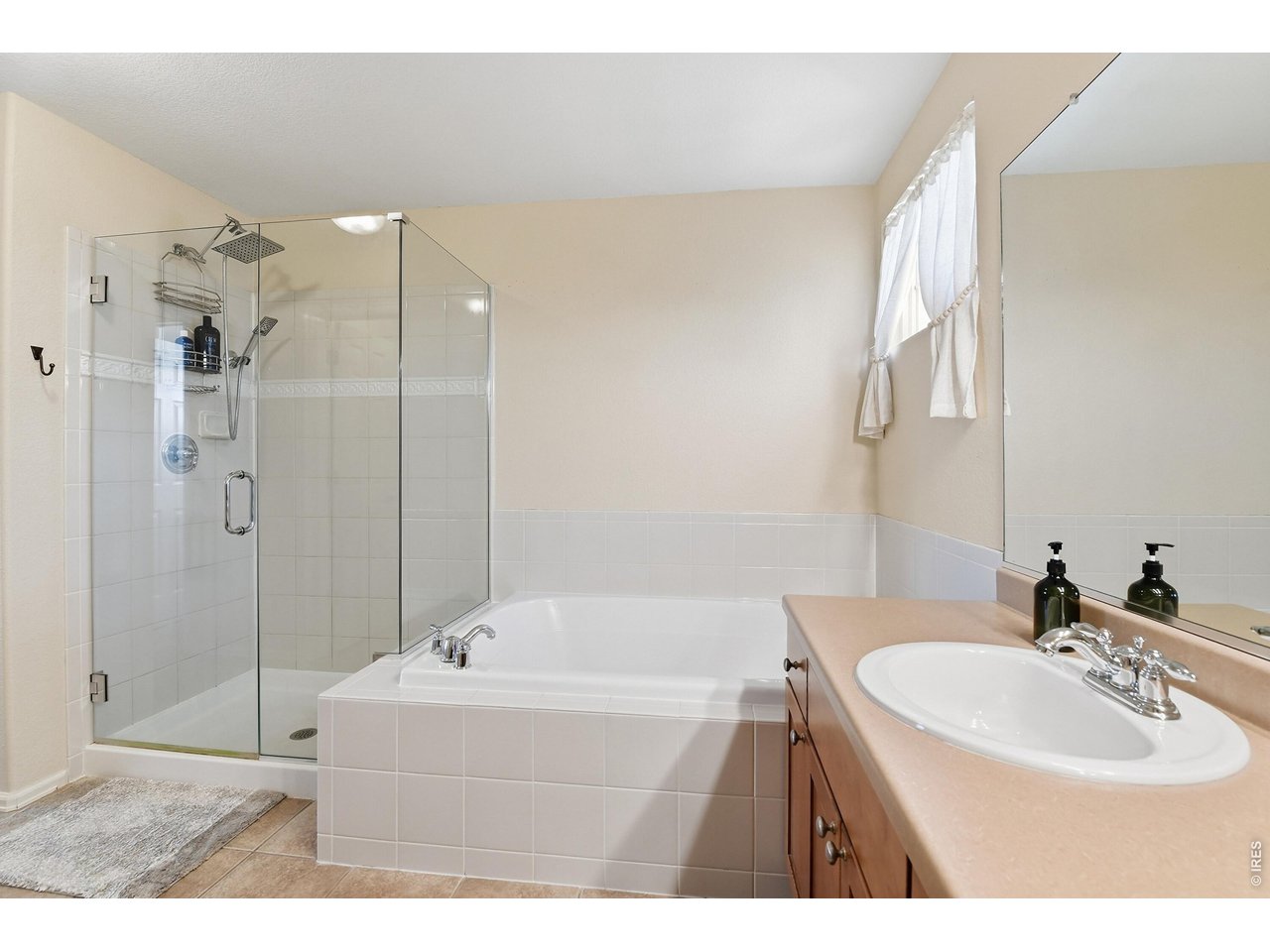 6291 Taylor Street Frederick, CO 80530 - Photo 21 of 50 a bathroom with a bathtub and a sink
