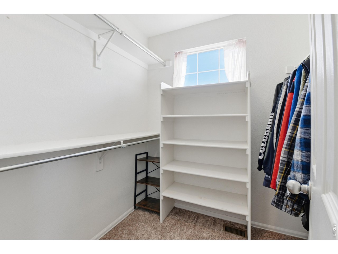 6291 Taylor Street Frederick, CO 80530 - Photo 23 of 50 a view of walk in closet with clothes and shoes