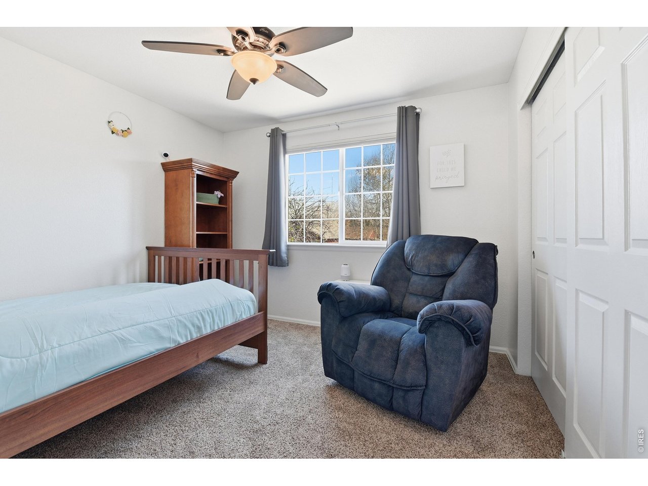 6291 Taylor Street Frederick, CO 80530 - Photo 28 of 50 a living room with a bed furniture and a window
