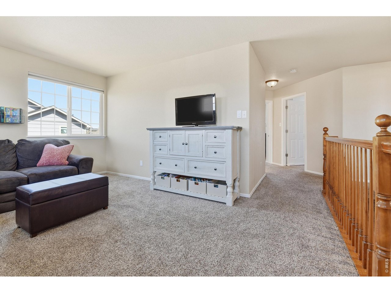 6291 Taylor Street Frederick, CO 80530 - Photo 30 of 50 a living room with furniture and a flat screen tv