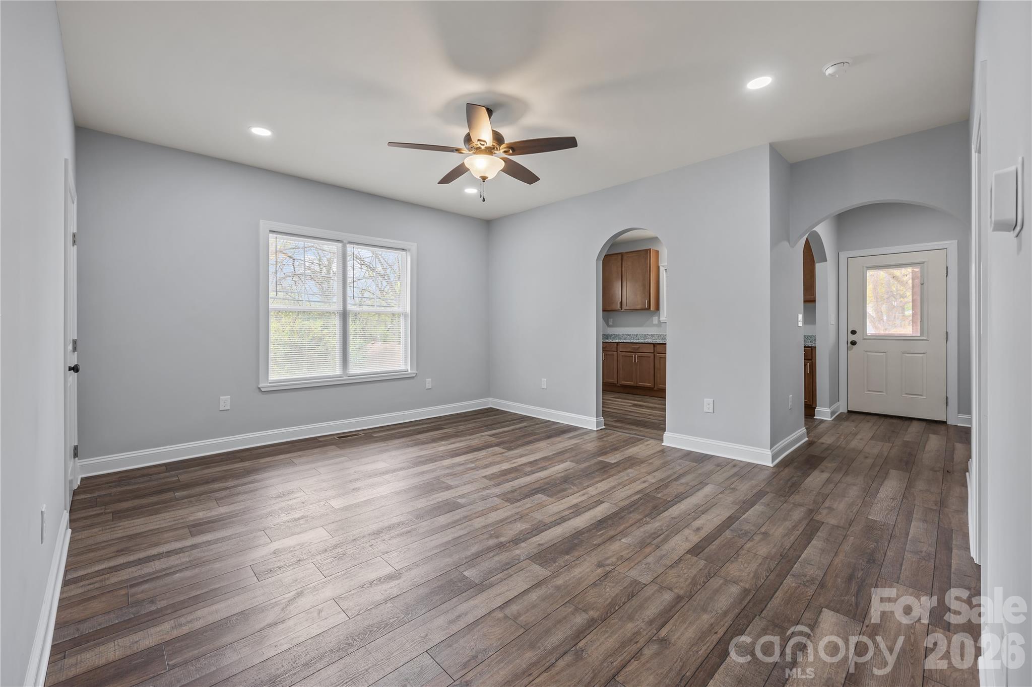 94 James Street Southwest Concord, NC 28025 - Photo 13 of 40 wooden floor in an empty room with a window