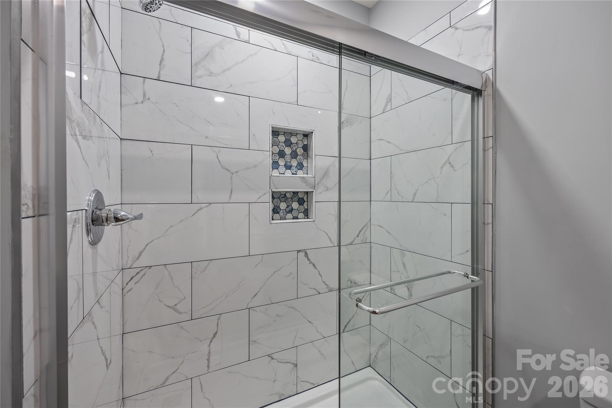94 James Street Southwest Concord, NC 28025 - Photo 16 of 40 a bathroom with a shower