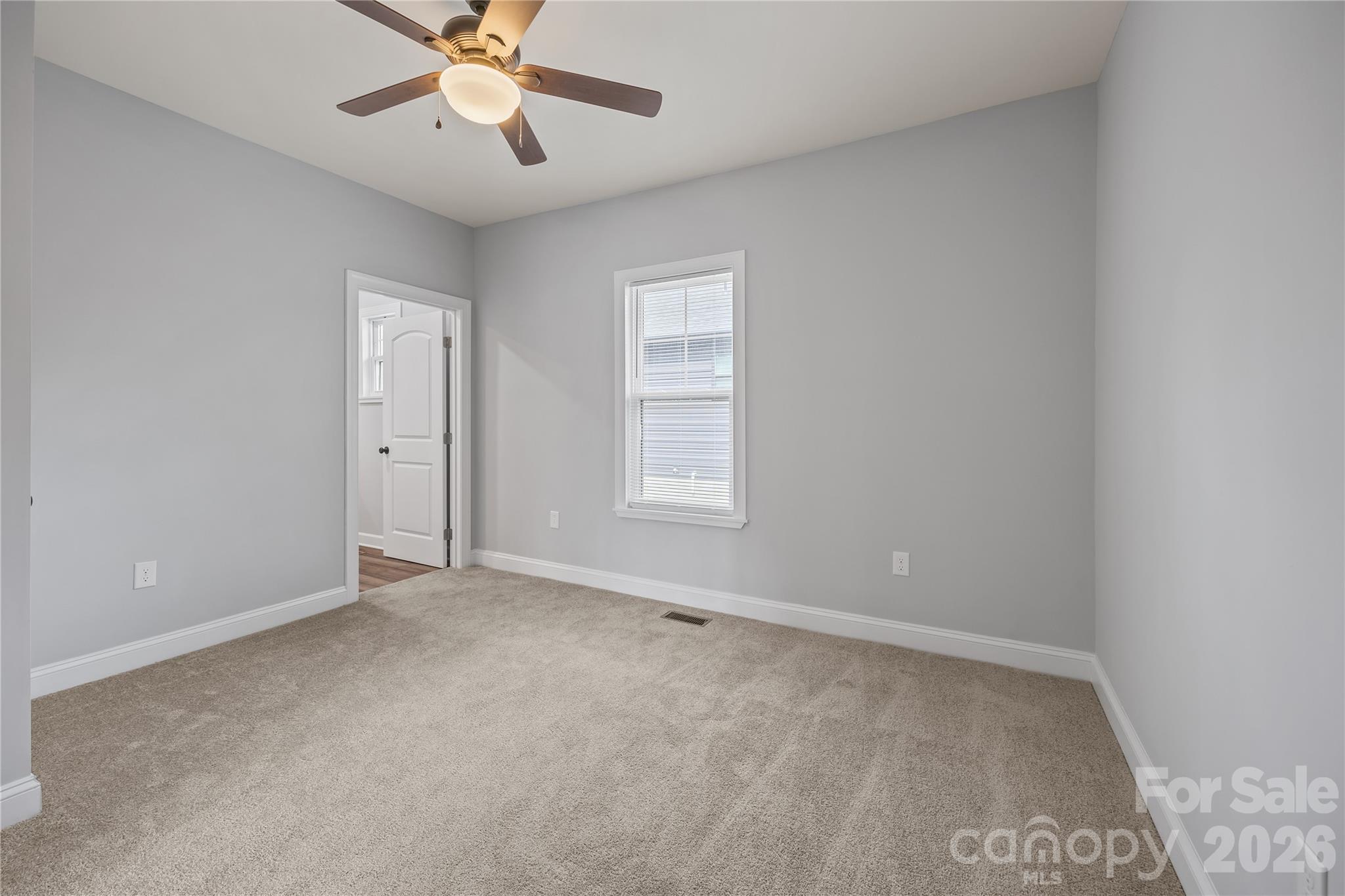 94 James Street Southwest Concord, NC 28025 - Photo 22 of 40 a view of an empty room with a window