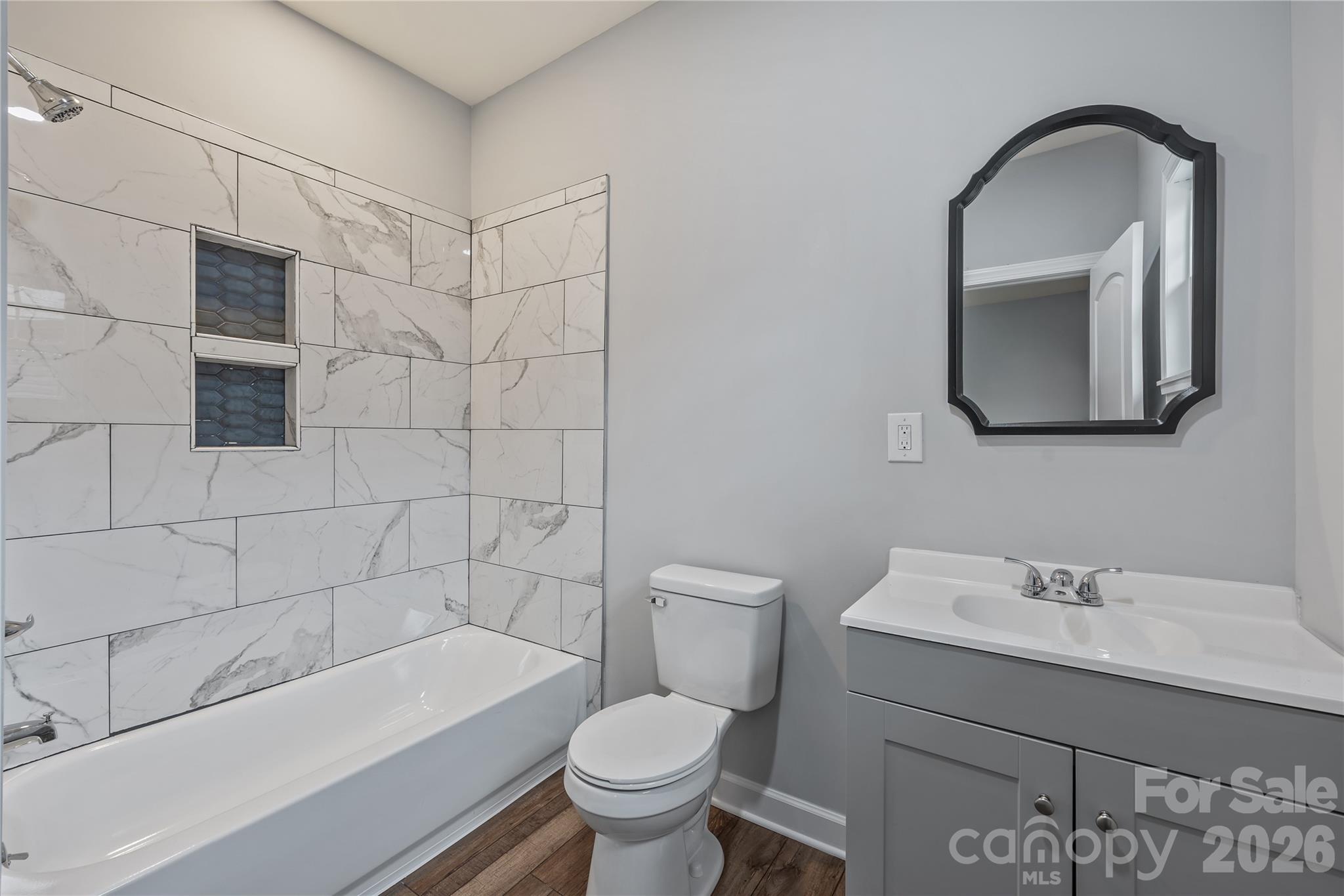 94 James Street Southwest Concord, NC 28025 - Photo 26 of 40 a bathroom with a sink toilet and shower