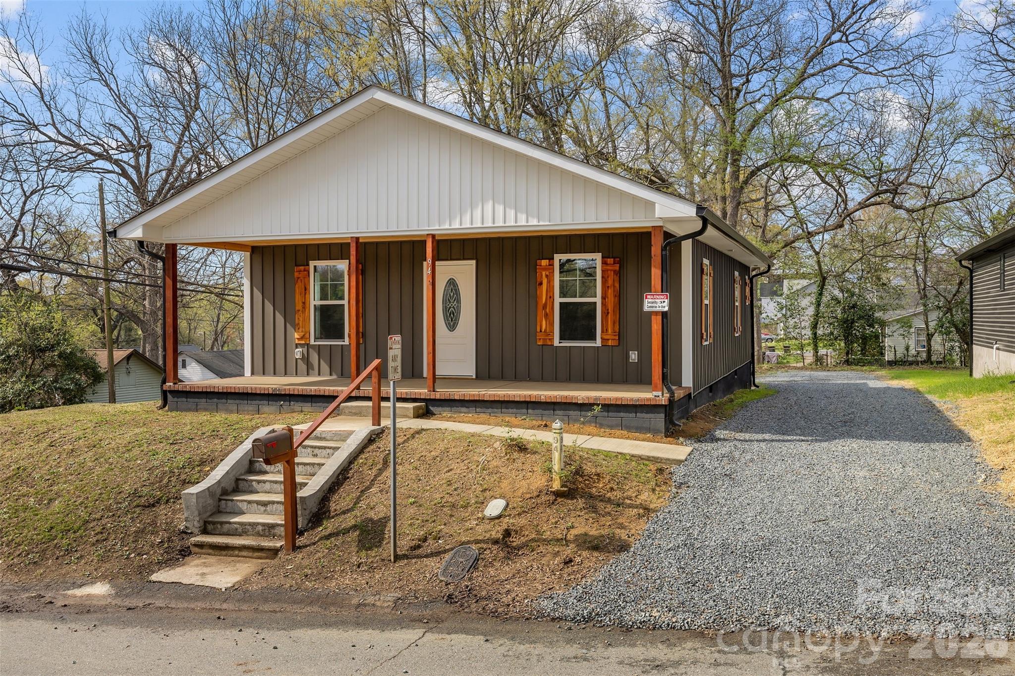 94 James Street Southwest Concord, NC 28025 - Photo 31 of 40 a front view of a house with a yard