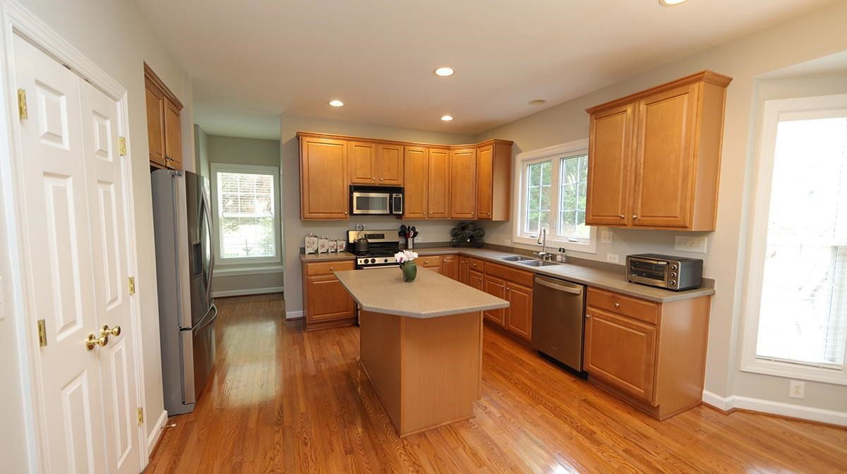 10705 Chesson Drive Raleigh, NC 27614 - Photo 7 of 30 Great workspace in the kitchen with island, stainless appliances including gas range, solid surface counters and tons of cabinet space. Kitchen