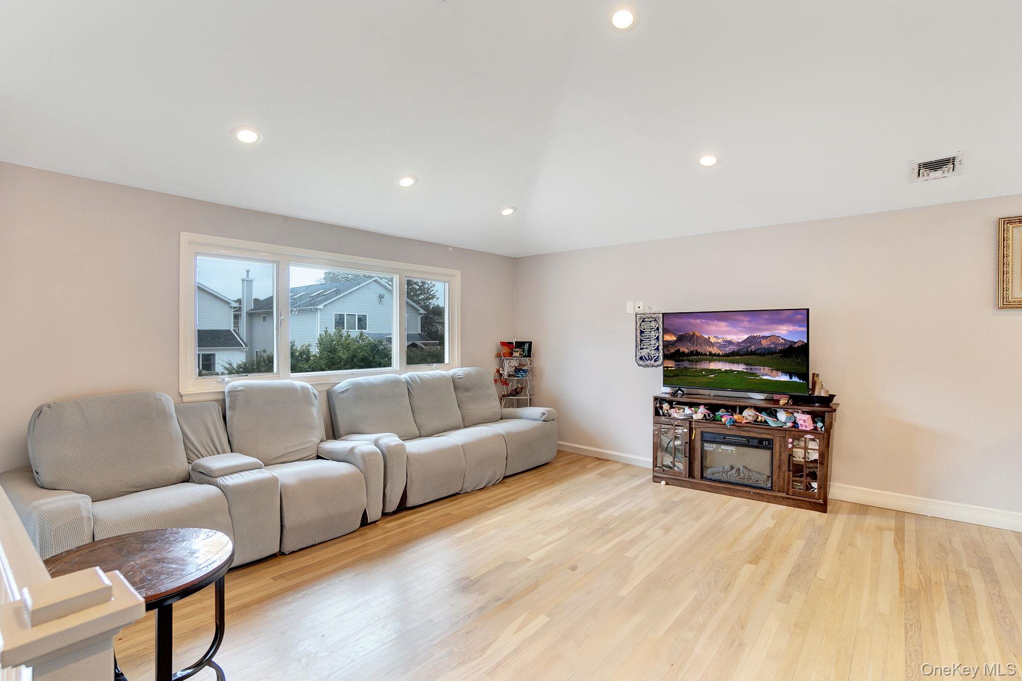 978 Little Whaleneck Road North Merrick, NY 11566 - Photo 11 of 32 Living area with recessed lighting and light wood finished floors