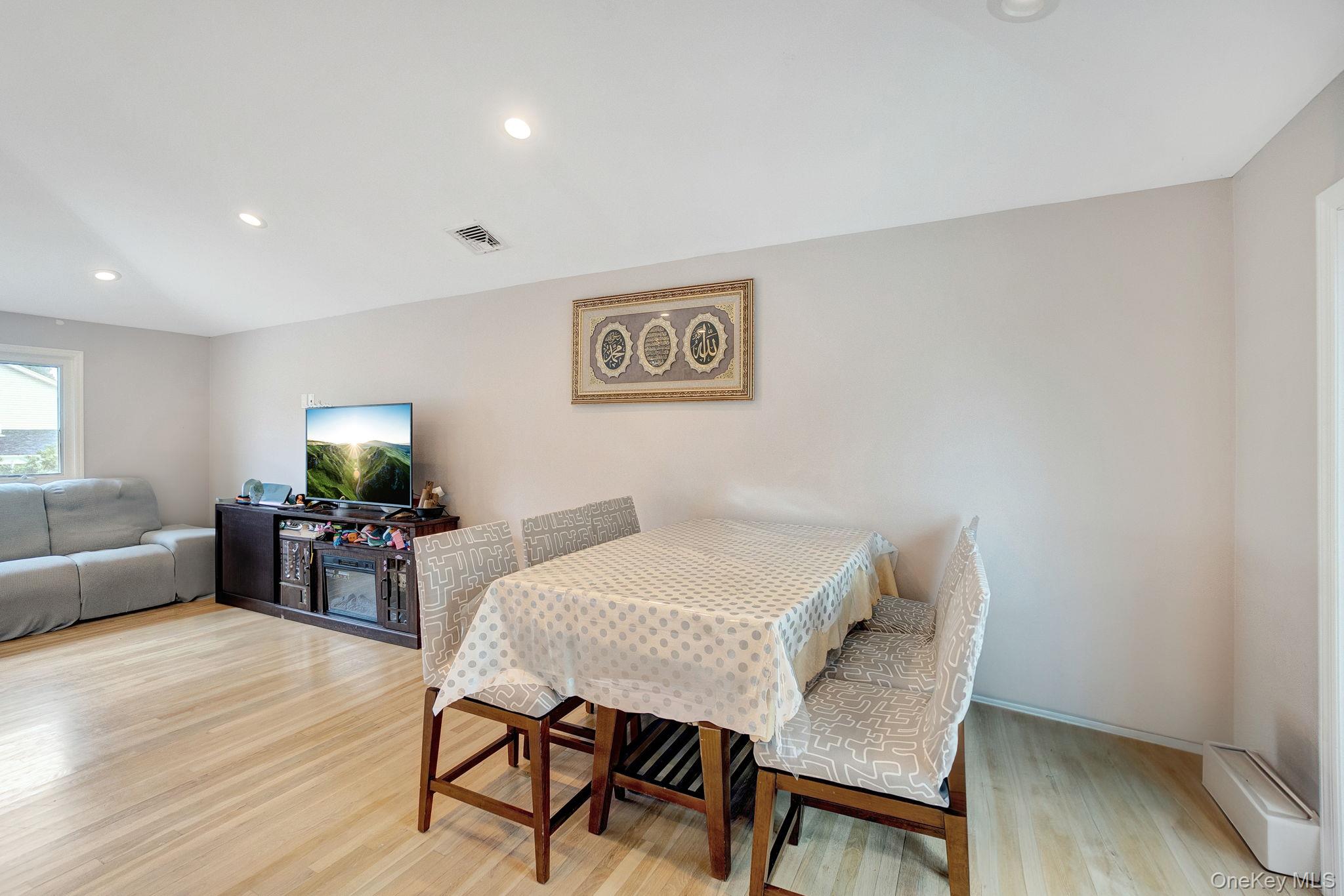 978 Little Whaleneck Road North Merrick, NY 11566 - Photo 6 of 32 Dining area with light wood-type flooring and recessed lighting