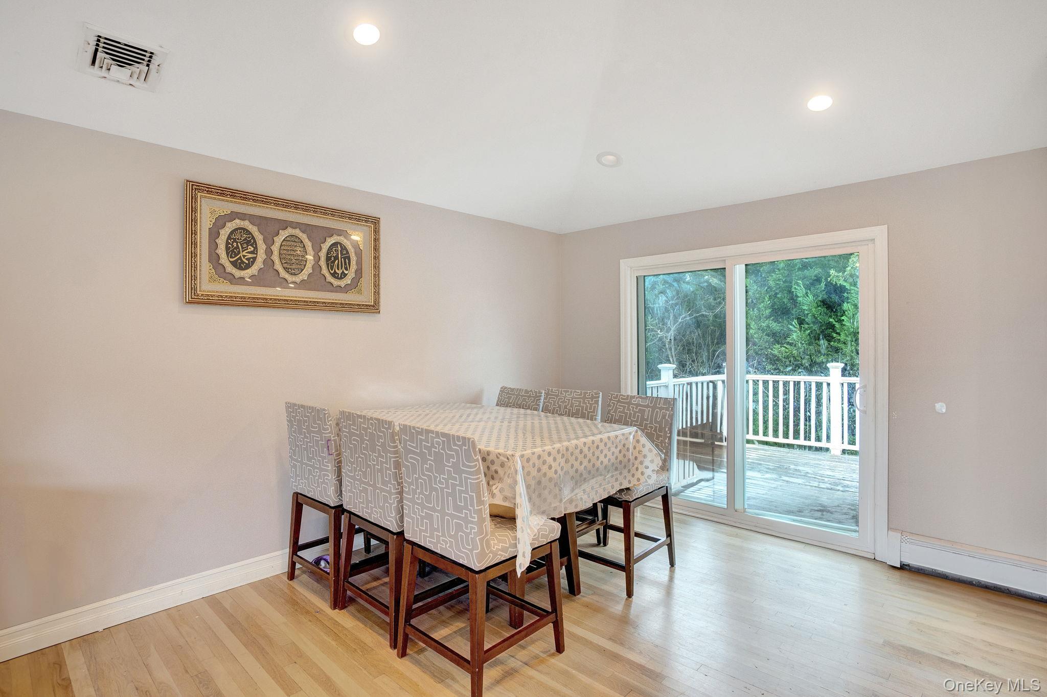 978 Little Whaleneck Road North Merrick, NY 11566 - Photo 7 of 32 Dining space featuring recessed lighting, light wood-style flooring, and lofted ceiling