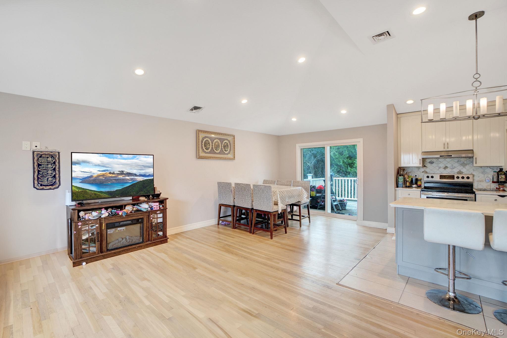 978 Little Whaleneck Road North Merrick, NY 11566 - Photo 8 of 32 Dining room featuring light wood-style floors and recessed lighting