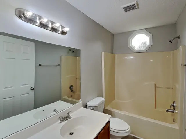 a view of balcony with wooden floor and fence