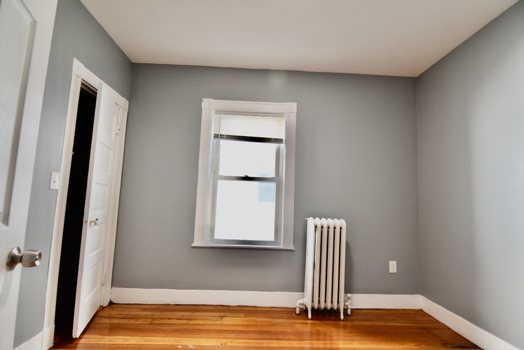 21 Treadway Road, Unit 2 Boston, MA 02125 - Photo 9 of 21 a view of front door with wooden floor
