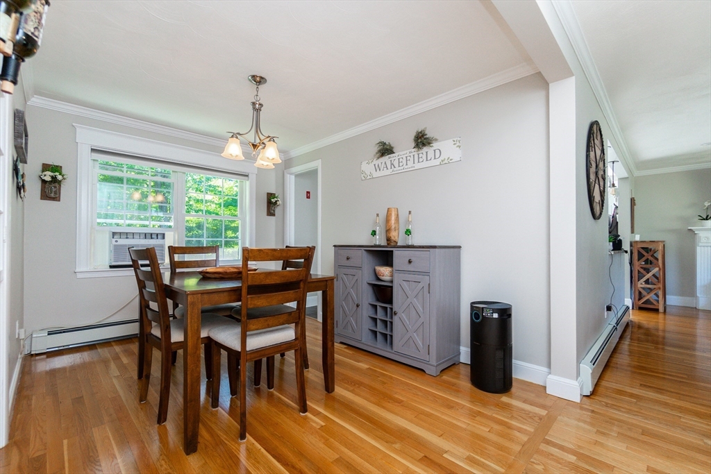 23 Thistledale Road Wakefield, MA 01880 - Photo 15 of 41 a dining room with furniture window wooden floor