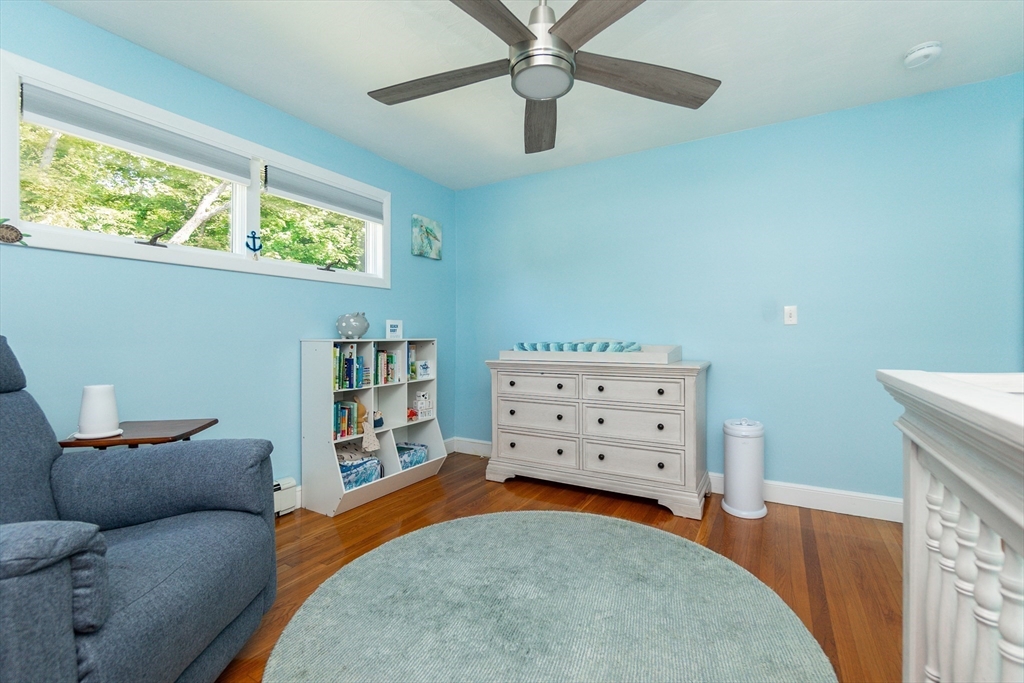 23 Thistledale Road Wakefield, MA 01880 - Photo 19 of 41 a living room with furniture and a flat screen tv