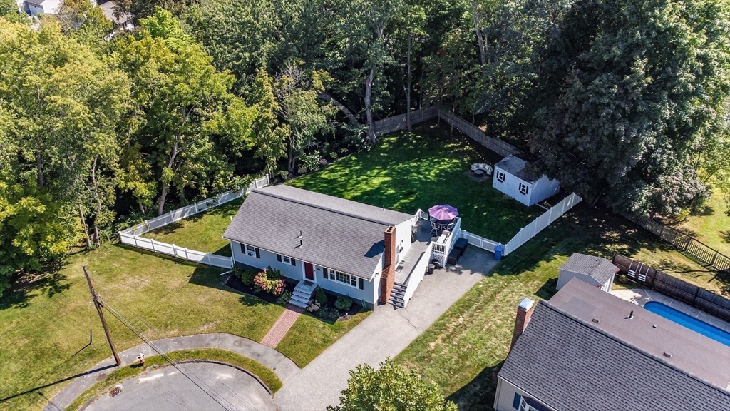 23 Thistledale Road Wakefield, MA 01880 - Photo 2 of 41 an aerial view of a house with swimming pool and a yard