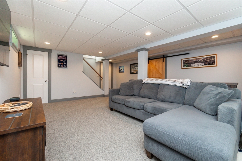 23 Thistledale Road Wakefield, MA 01880 - Photo 22 of 41 a living room with furniture and a ceiling fan