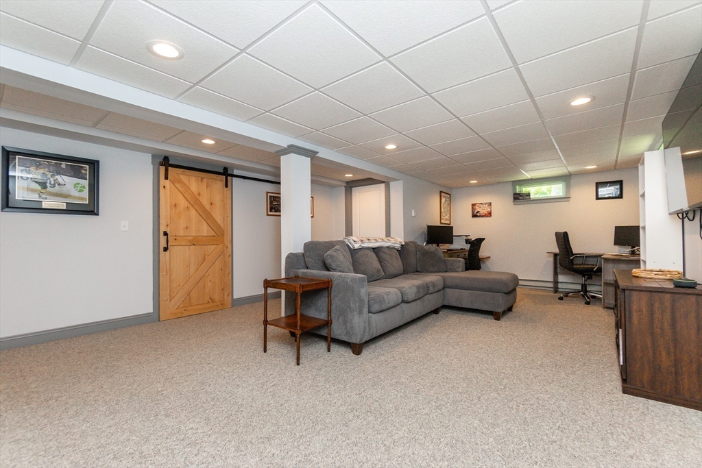 23 Thistledale Road Wakefield, MA 01880 - Photo 23 of 41 a living room with furniture and a window