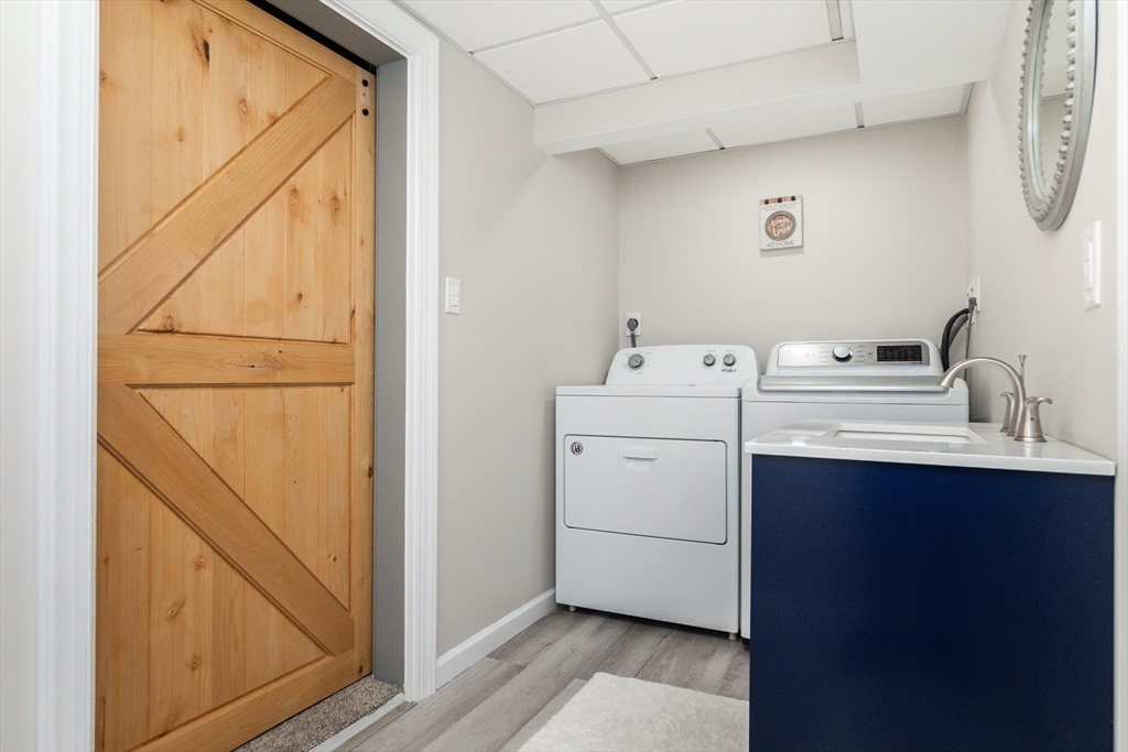 23 Thistledale Road Wakefield, MA 01880 - Photo 27 of 41 a utility room with dryer and washer