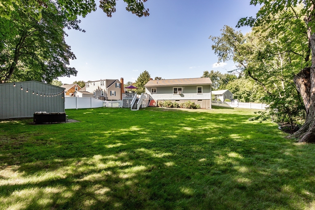 23 Thistledale Road Wakefield, MA 01880 - Photo 30 of 41 a view of a house with a big yard and large trees