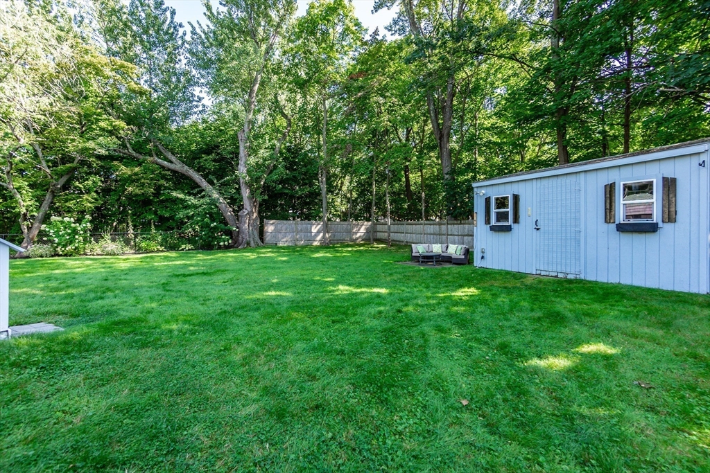 23 Thistledale Road Wakefield, MA 01880 - Photo 31 of 41 a backyard of a house with table and chairs