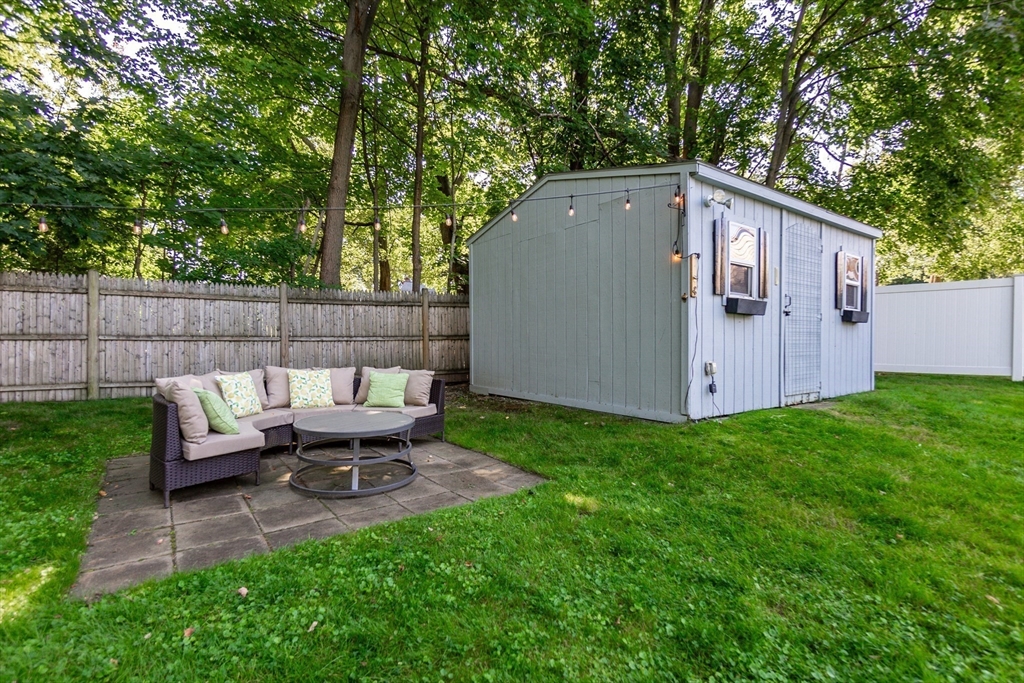 23 Thistledale Road Wakefield, MA 01880 - Photo 36 of 41 a backyard of a house with table and chairs