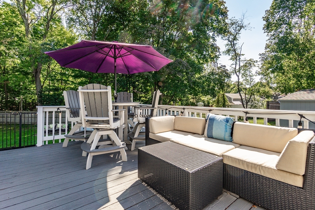 23 Thistledale Road Wakefield, MA 01880 - Photo 38 of 41 a view of a patio with chairs and wooden floor