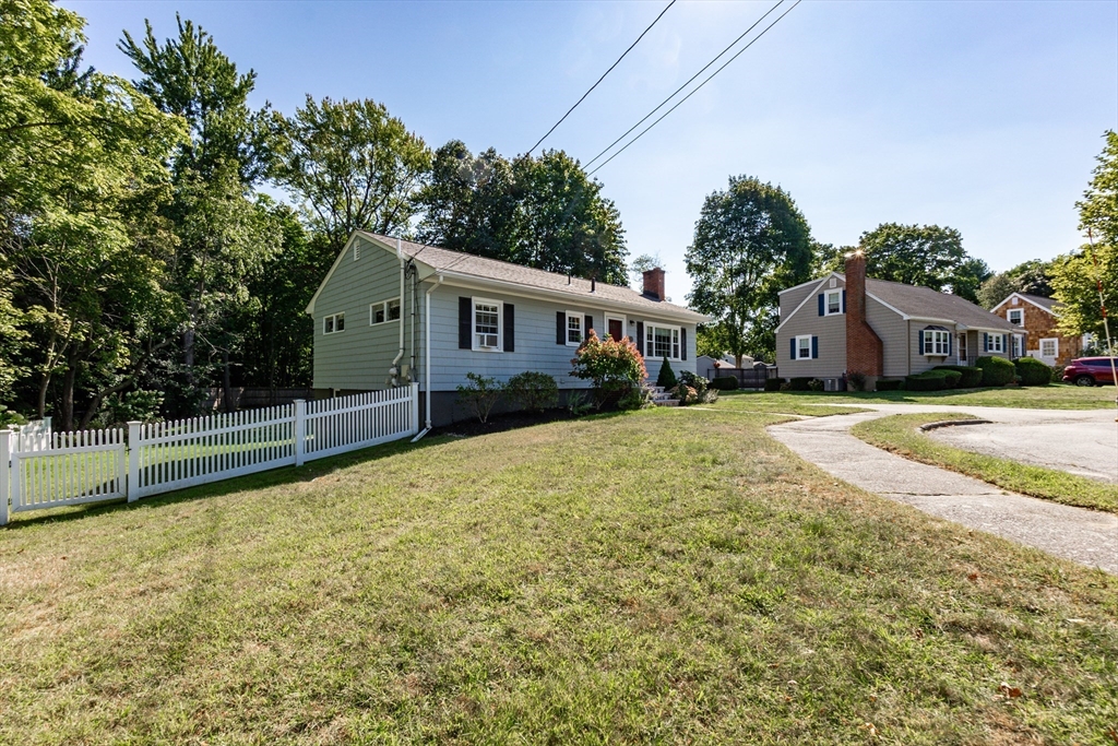 23 Thistledale Road Wakefield, MA 01880 - Photo 39 of 41 a view of a house with a yard and sitting area