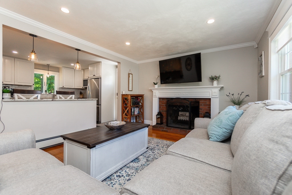 23 Thistledale Road Wakefield, MA 01880 - Photo 6 of 41 a living room with furniture and a fireplace