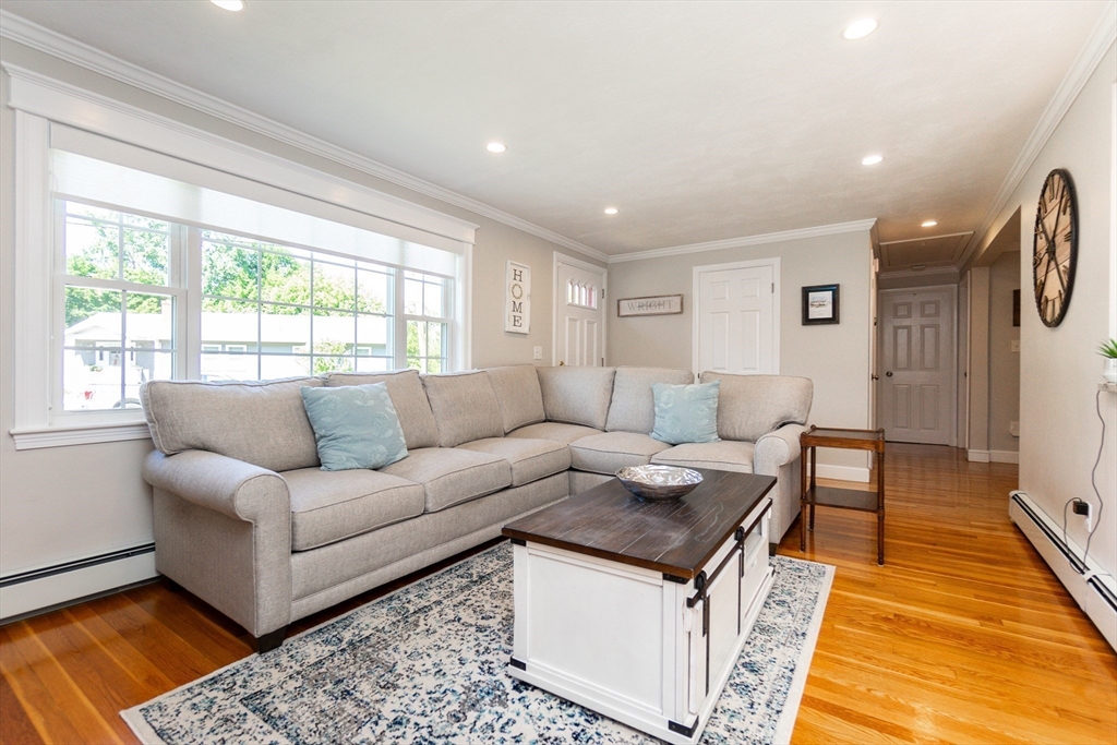 23 Thistledale Road Wakefield, MA 01880 - Photo 7 of 41 a living room with furniture and a rug