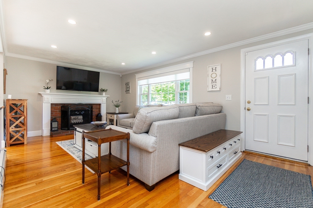 23 Thistledale Road Wakefield, MA 01880 - Photo 8 of 41 a living room with furniture and a flat screen tv