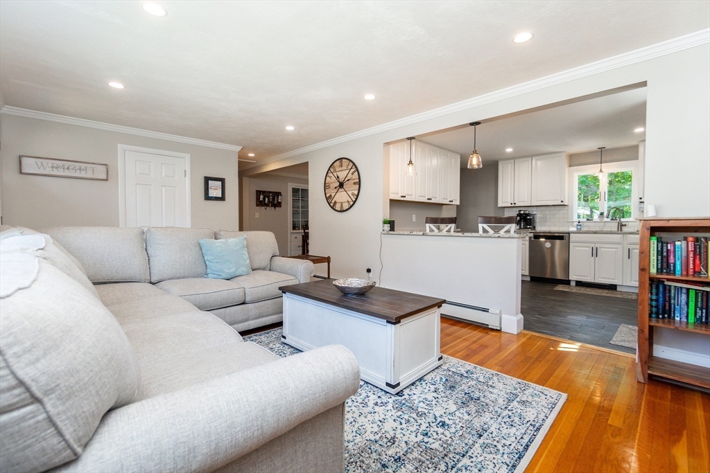 23 Thistledale Road Wakefield, MA 01880 - Photo 9 of 41 a living room with furniture and a table