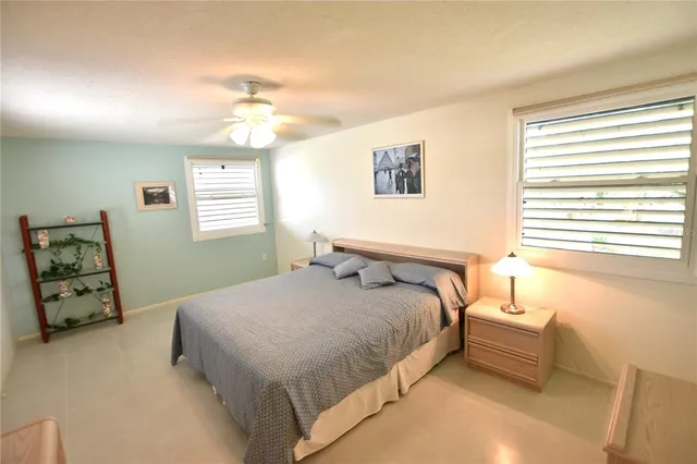 a bedroom with two beds and a table