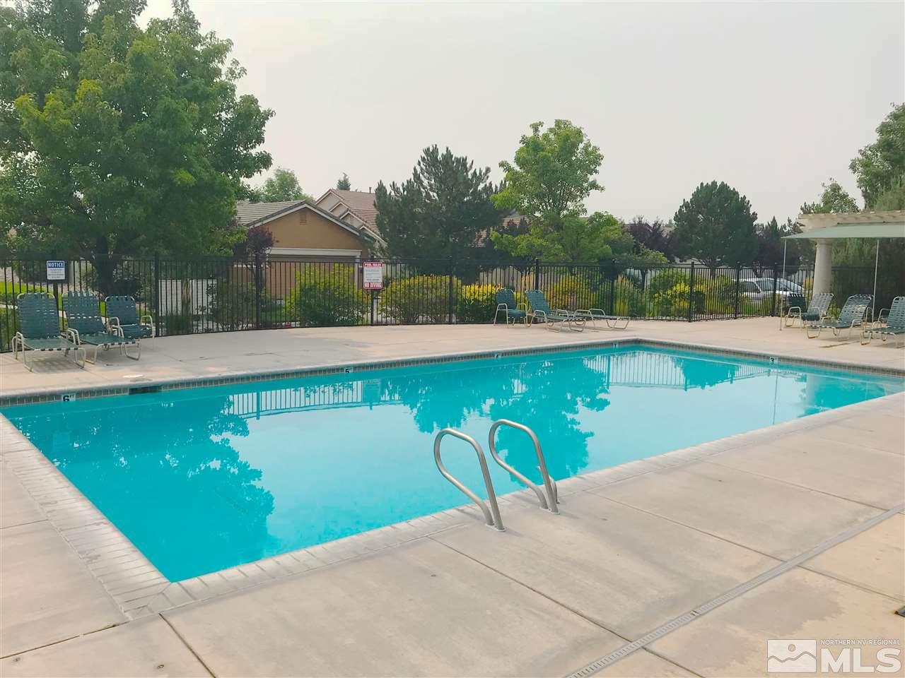 1615 Mountain Lane Reno, NV 89521 - Photo 20 of 20 a view of a swimming pool with a yard