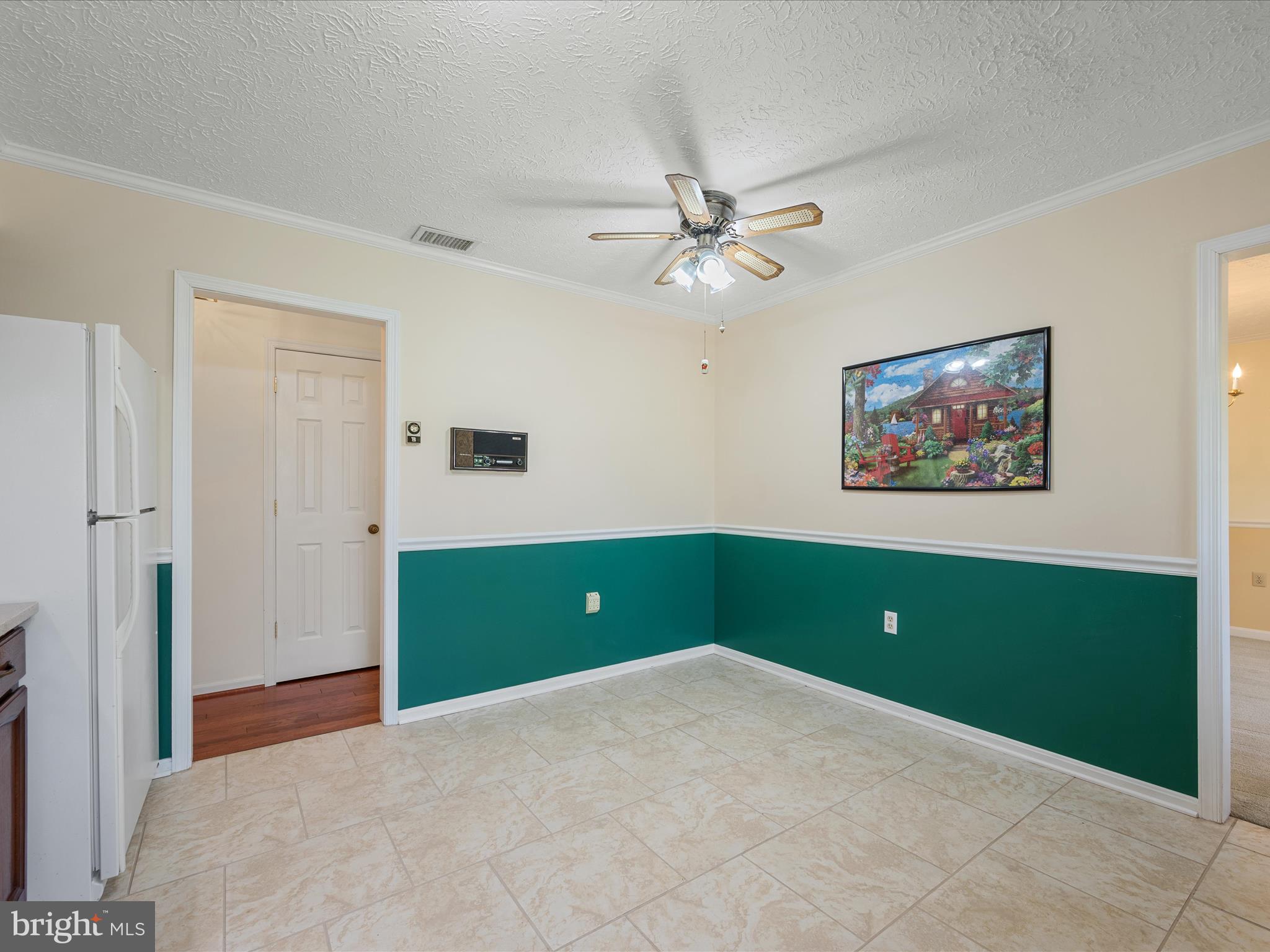 209 Sterrett Lane Winchester, VA 22603 - Photo 12 of 52 a room with a fan and a window