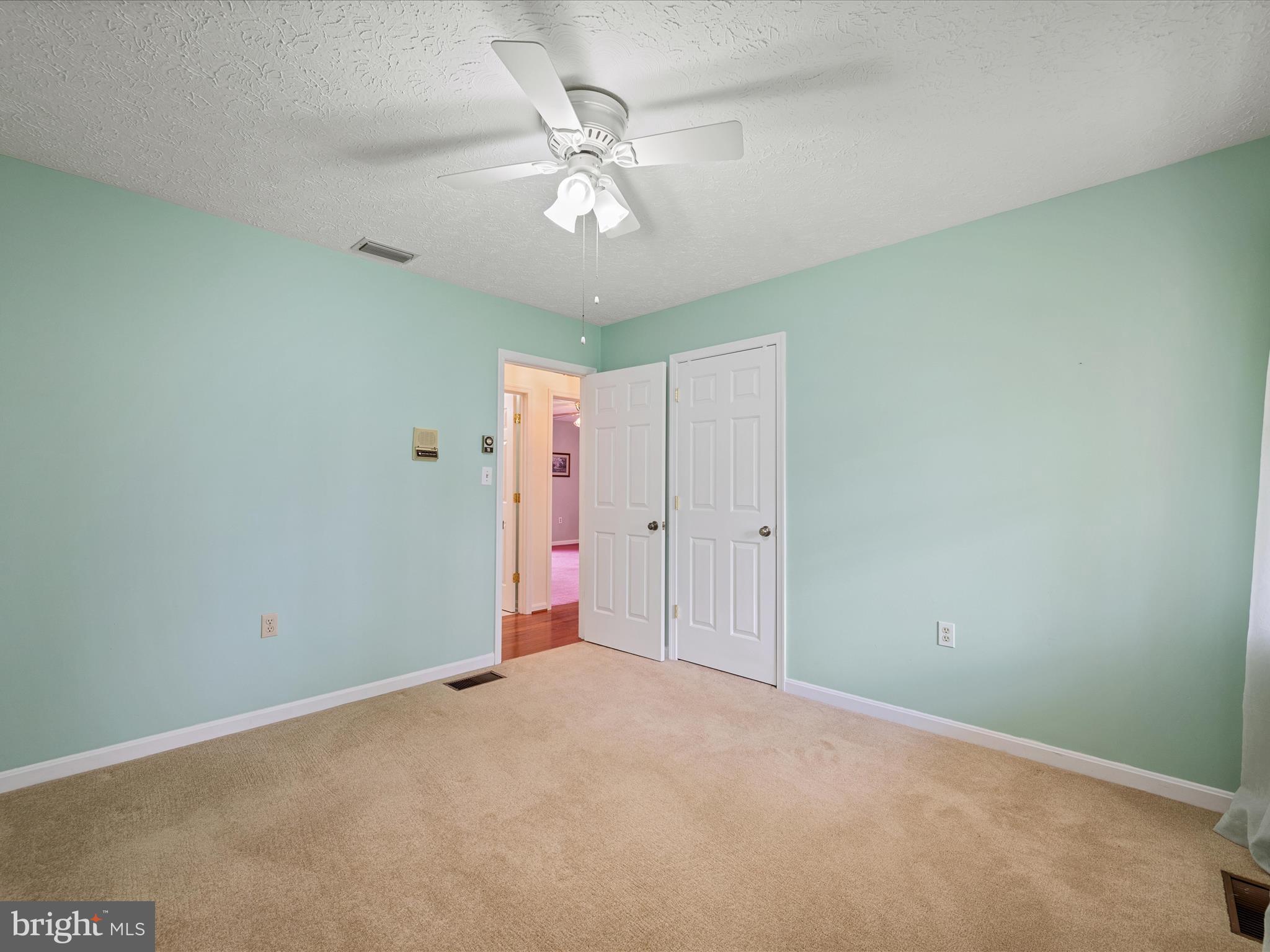 209 Sterrett Lane Winchester, VA 22603 - Photo 22 of 52 a view of a livingroom with a chandelier fan