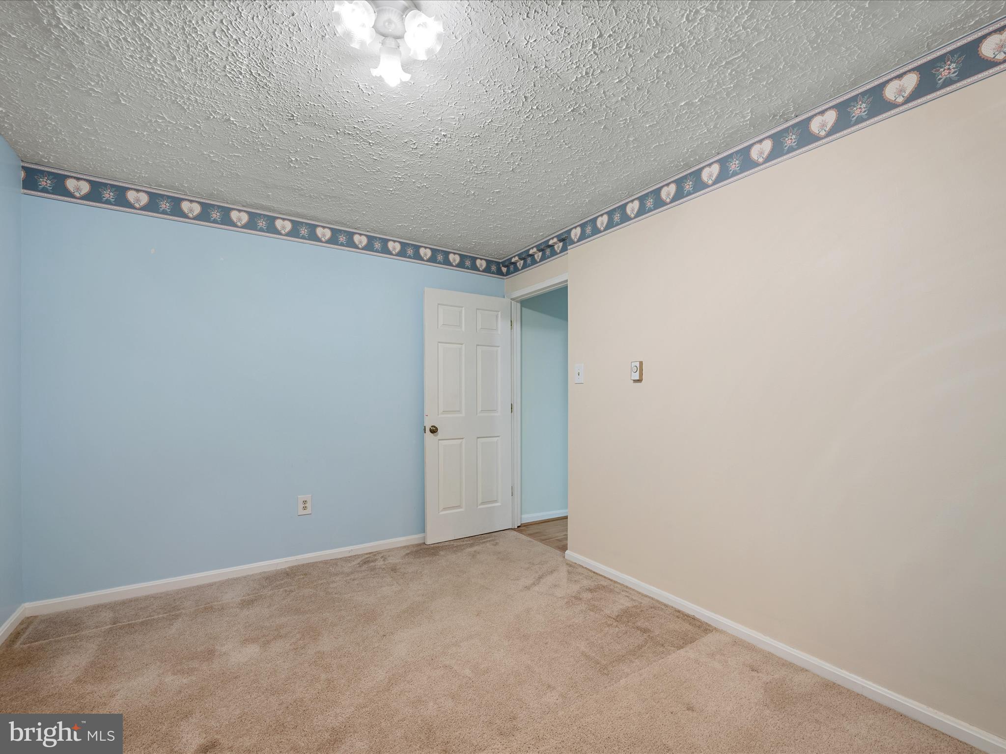 209 Sterrett Lane Winchester, VA 22603 - Photo 30 of 52 a view of a room with racks on the wall