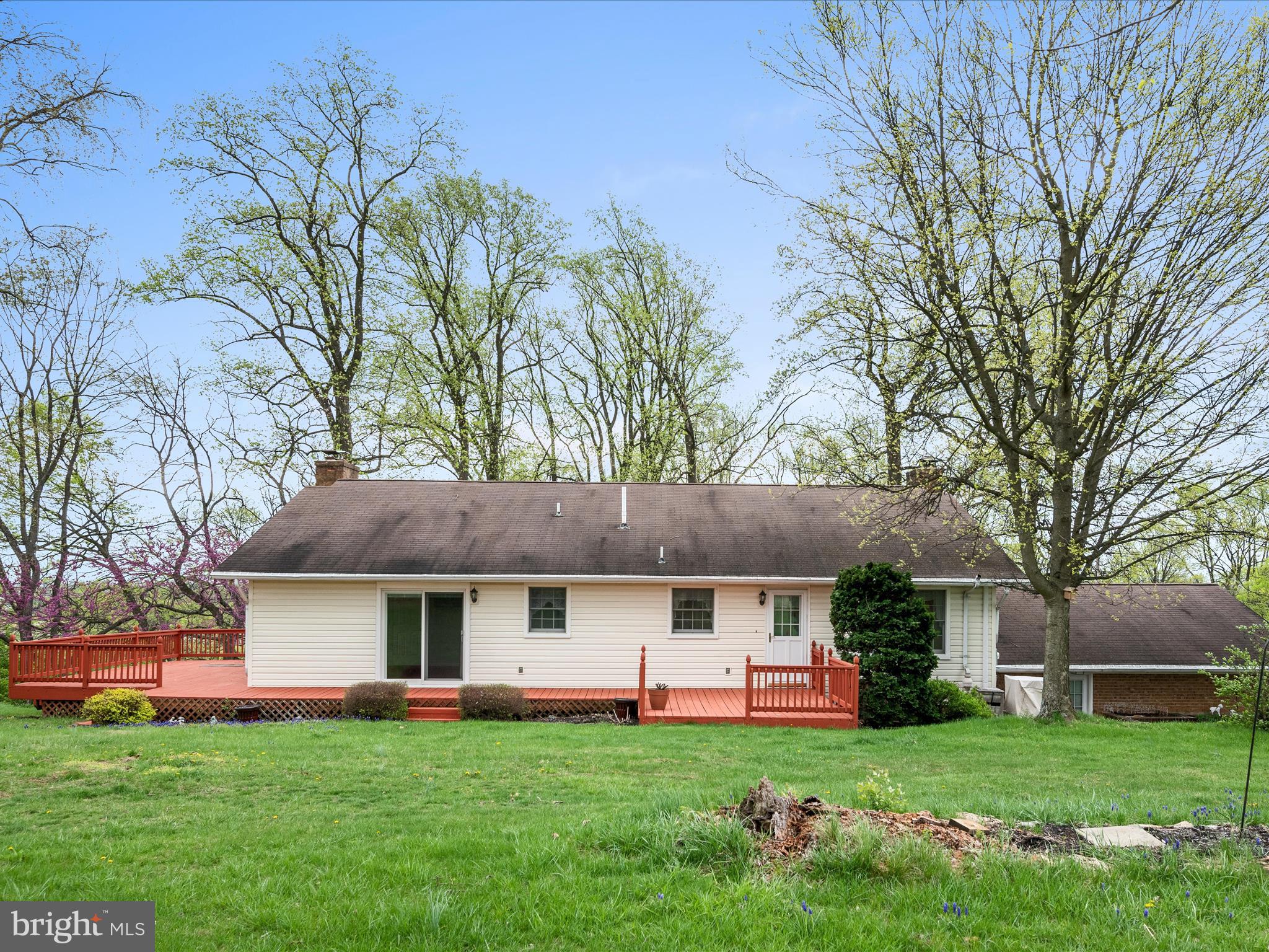 209 Sterrett Lane Winchester, VA 22603 - Photo 41 of 52 a front view of a house with a garden and trees