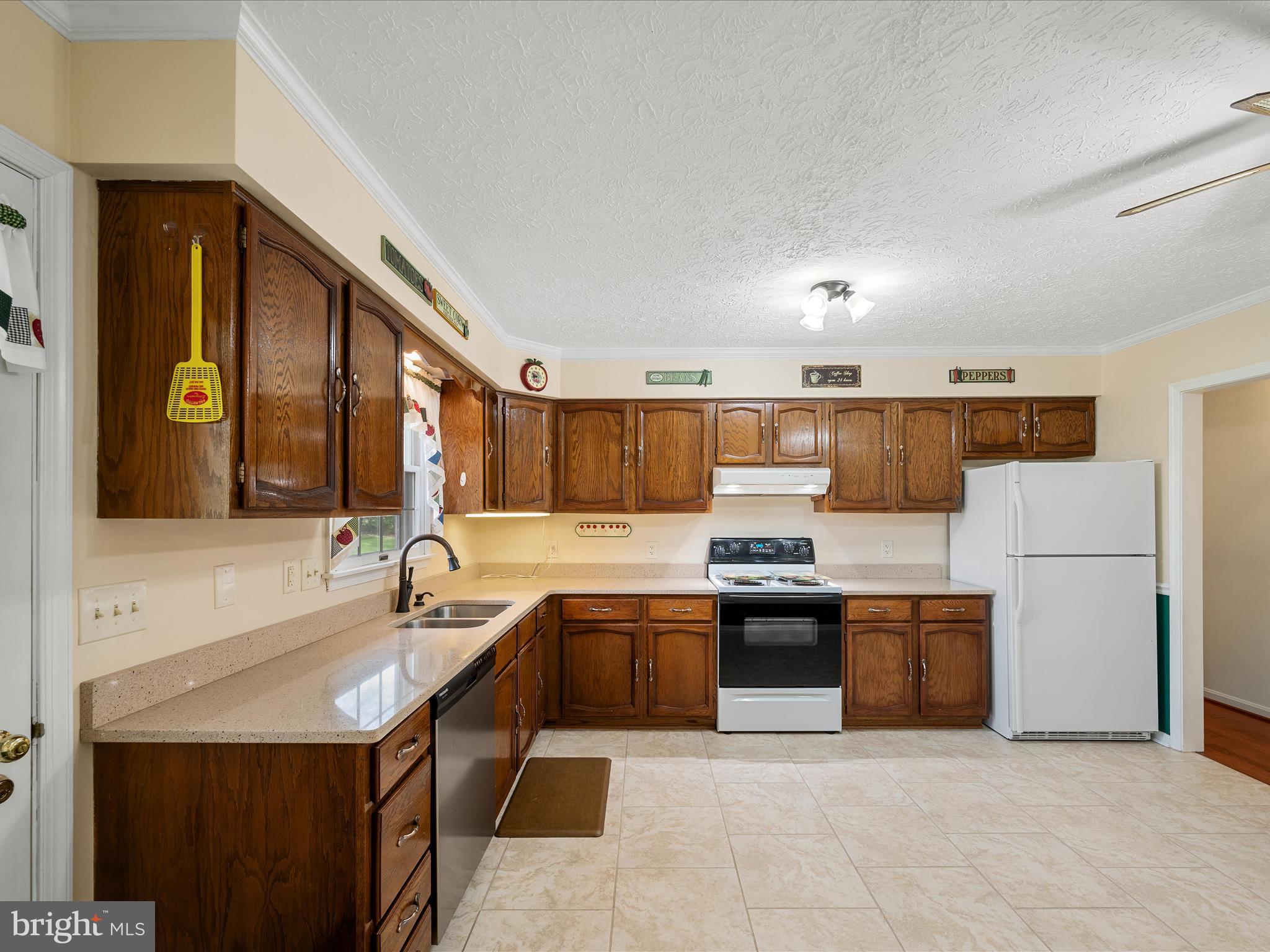 209 Sterrett Lane Winchester, VA 22603 - Photo 10 of 52 a kitchen with stainless steel appliances granite countertop a sink counter space and cabinets