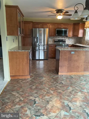 a view of a kitchen with a sink