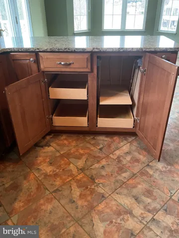 a view of front door with washer and dryer