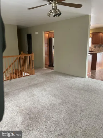 a view of a hallway with a livingroom