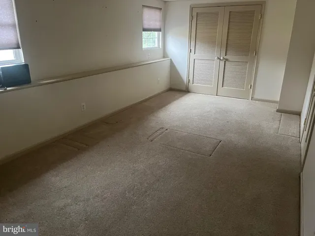 a view of empty room with windows