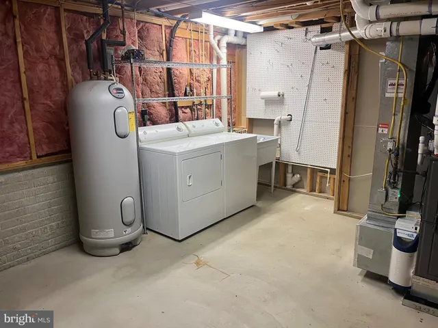 a view of a refrigerator in kitchen and entryway