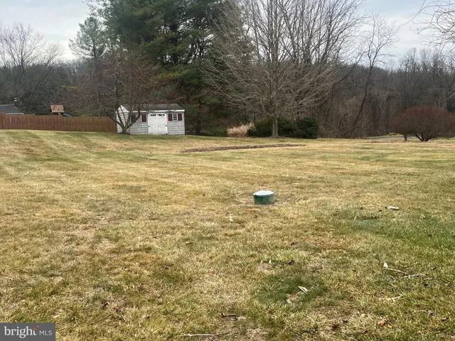 a view of swimming pool with trees