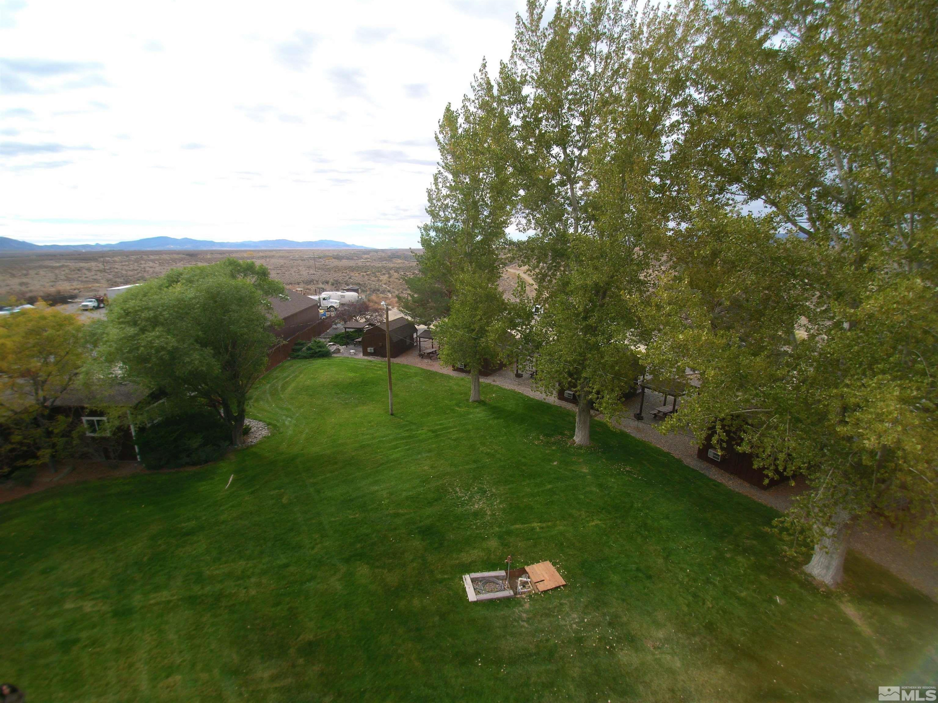 22580 Button Lake Trail, Unit 202 Lovelock, NV 89419 - Photo 24 of 29 a view of a green field with clear sky