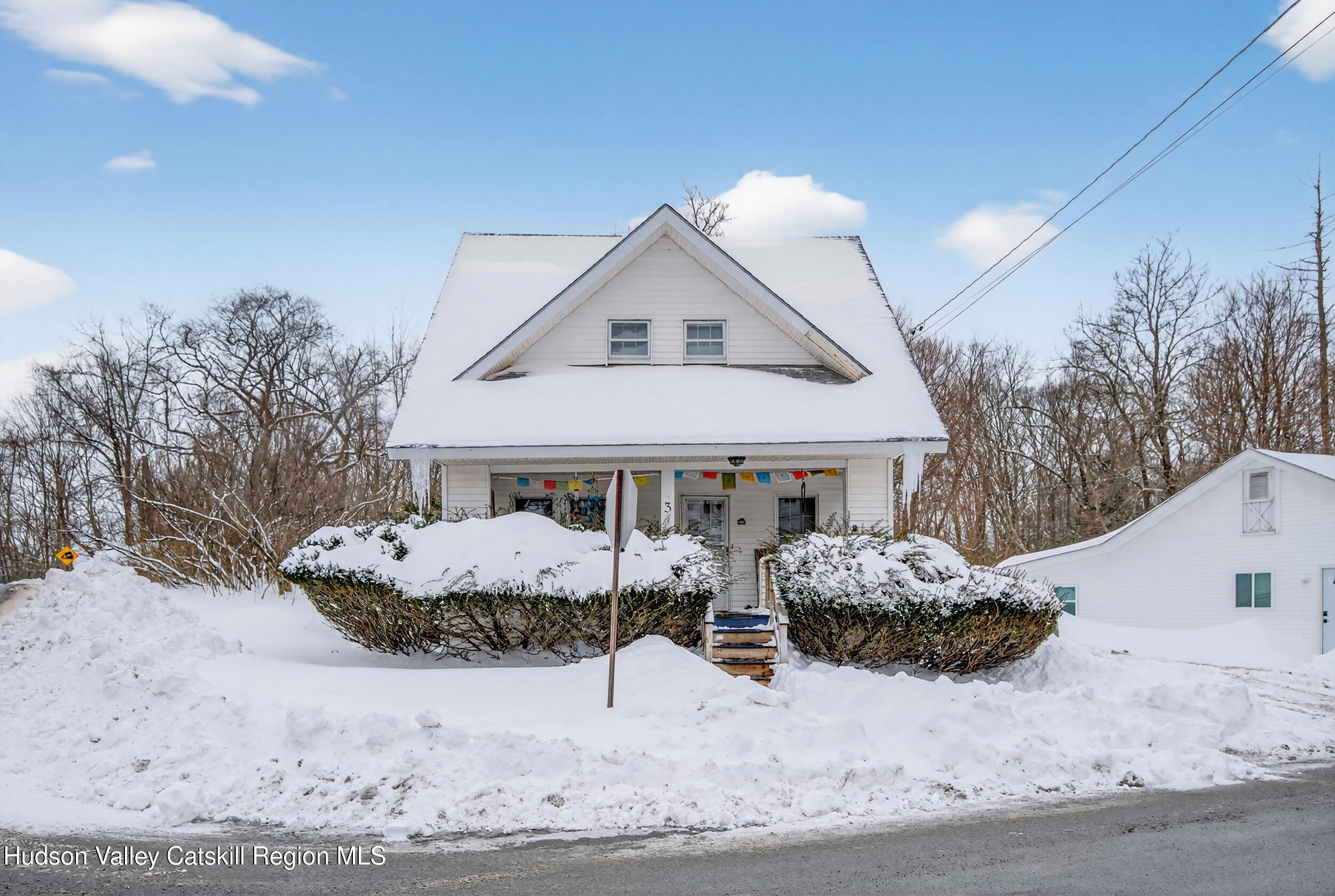 3-5 Dutchtown Road Saugerties, NY 12477 - Photo 2 of 25 a view of a house with a yard covered in snow