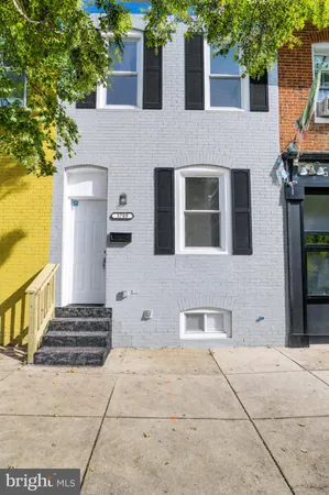 a front view of a house with stairs