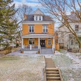 a front view of a house with stairs yard