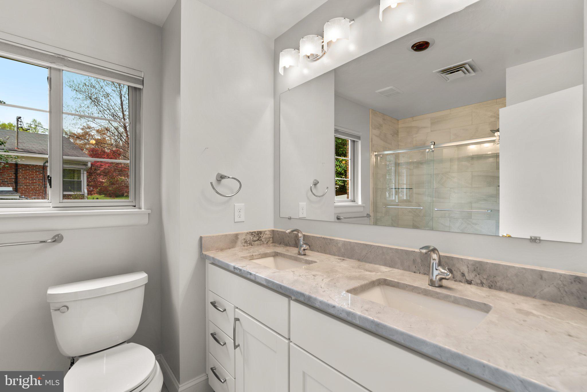 9315 Harvey Road Silver Spring, MD 20910 - Photo 29 of 44 2nd Full Bathroom with double sink and tub/shower